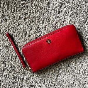 Red leather Tory Burch Robinson long wallet or wristlet with a gold-tone logo